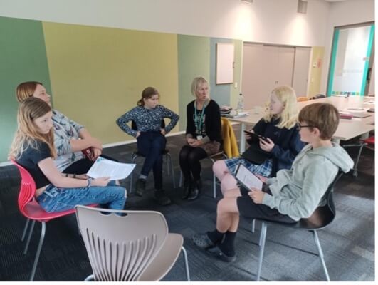 Akonga and teachers discussing their eye conditions with each other